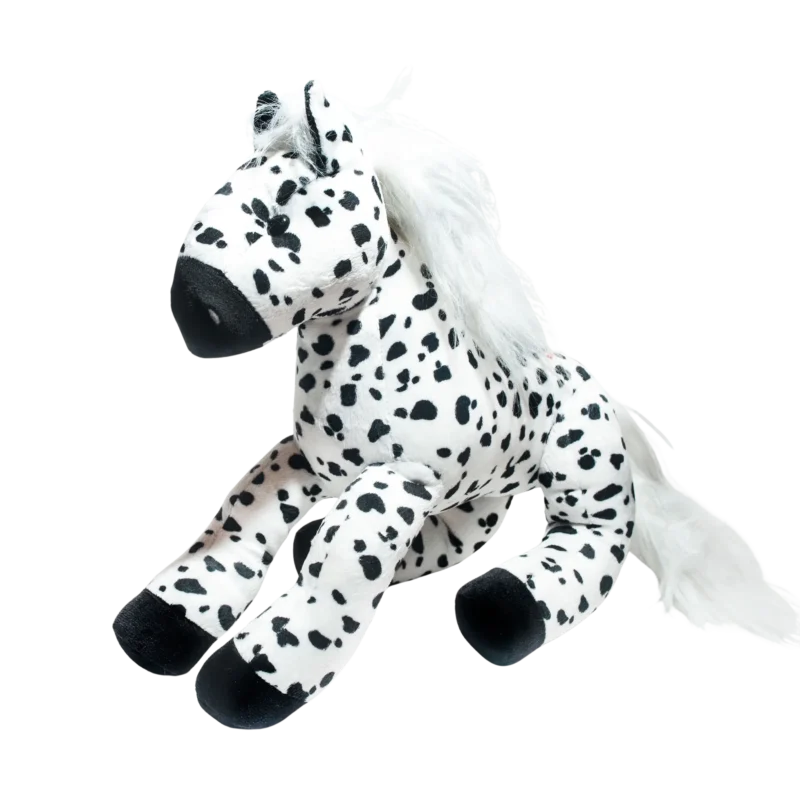 Caballo de peluche con manchas negras sobre fondo blanco caballo de peluche La Tarumba